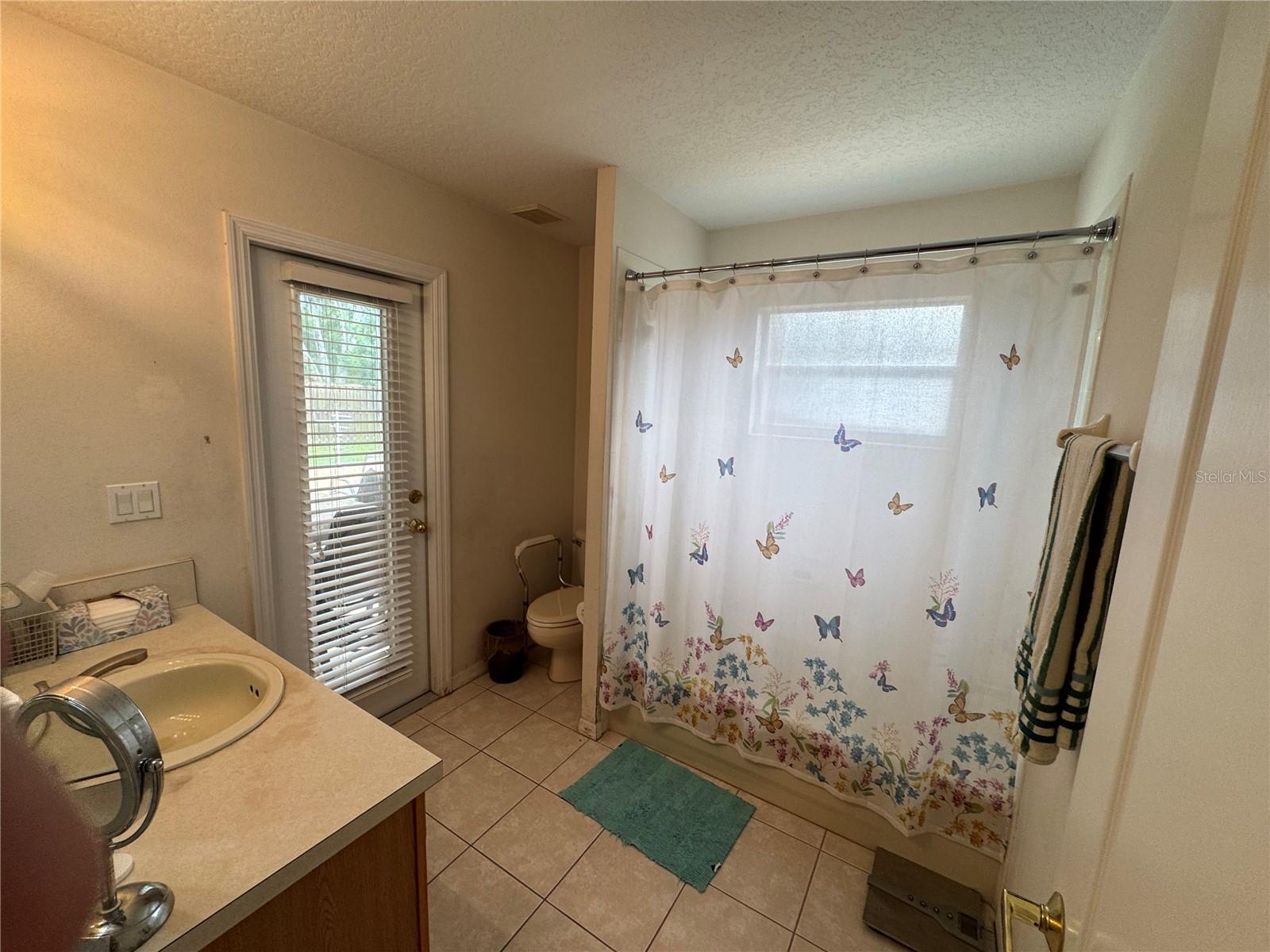 Bathroom #3 with outside door to Pool