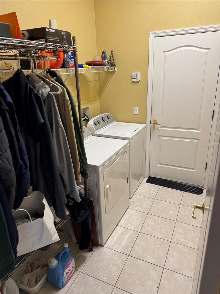 Inside utility room with Washer and Dryer included