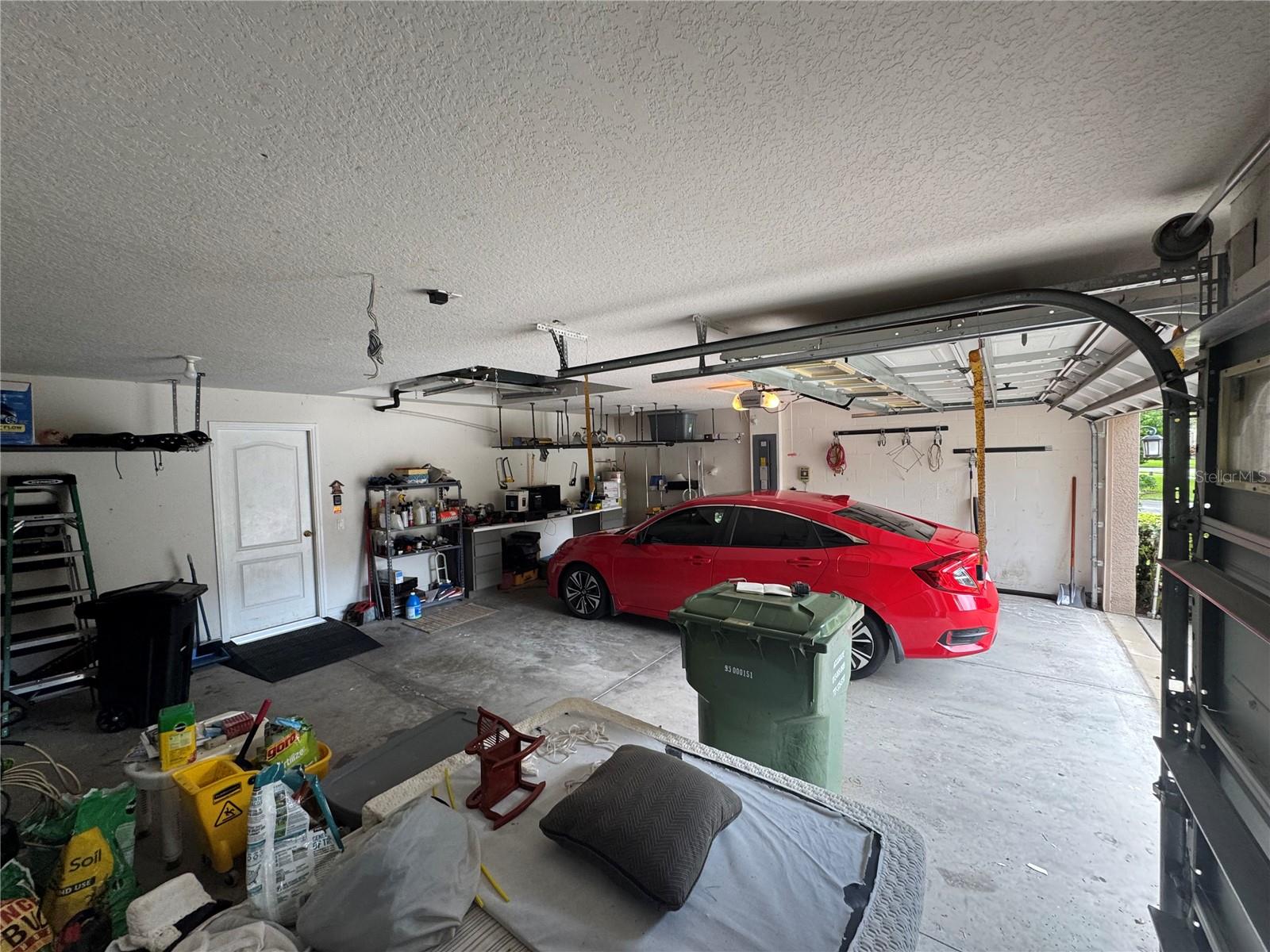 3 car garage with garage door remote lift
