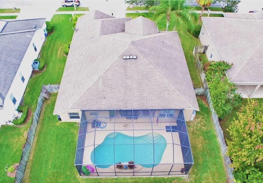 Drone view of house and pool from above
