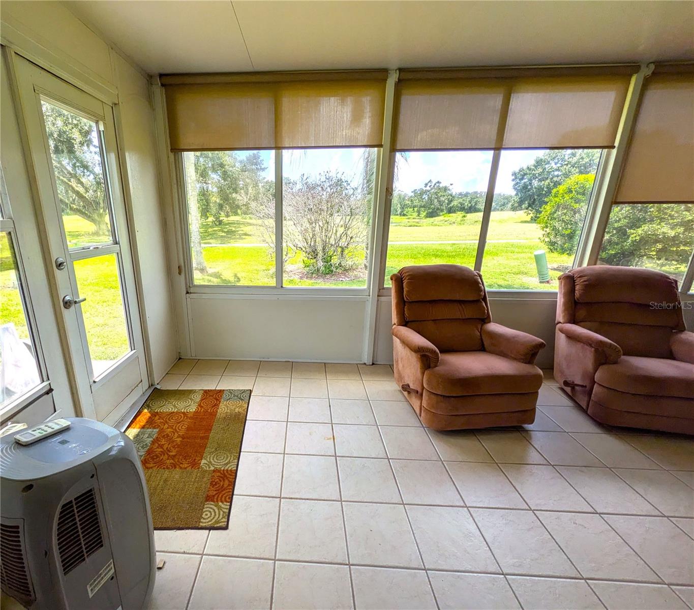 View of Pond from enclosed Florida Room