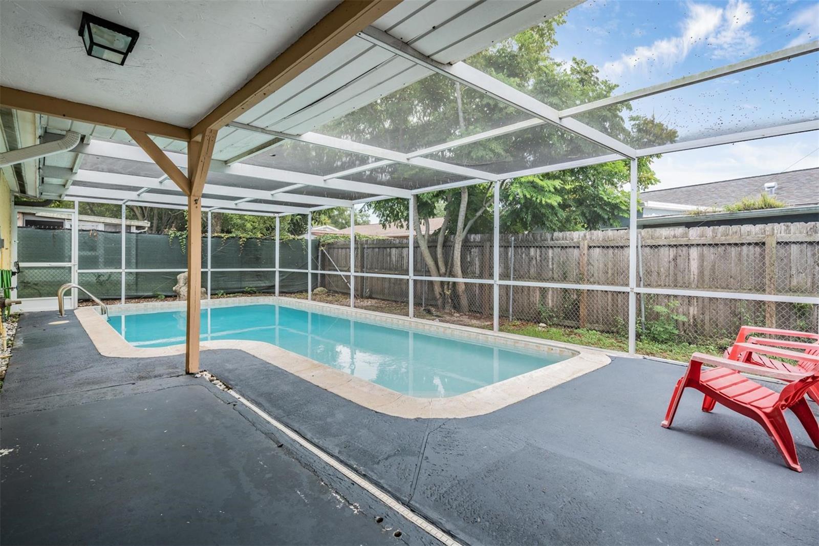screened in pool and patio perfect for enjoying sunshine year-round