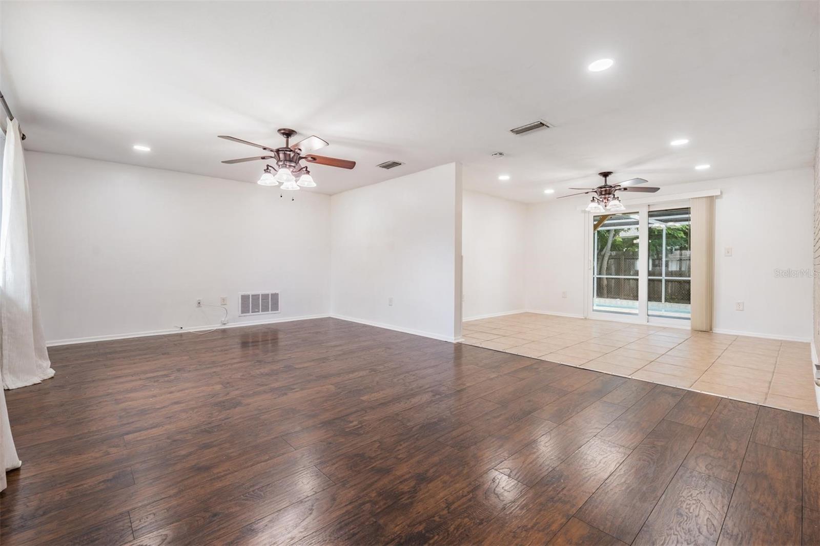Large open concept layout with living and dining room combo
