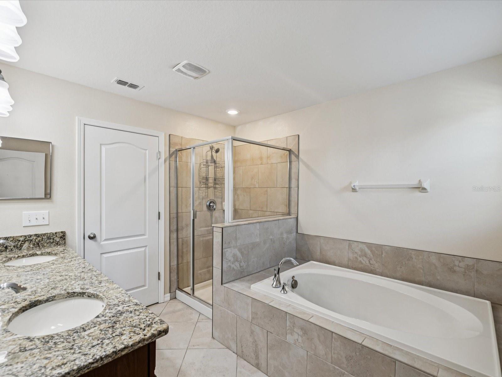 Soaking tub with separate shower