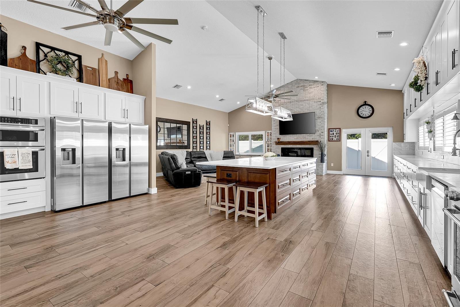 Open Concept Kitchen, oversized island, family area, fireplace