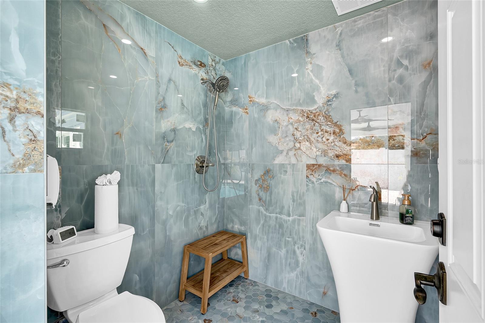 Full bath access from pool and outdoor kitchen