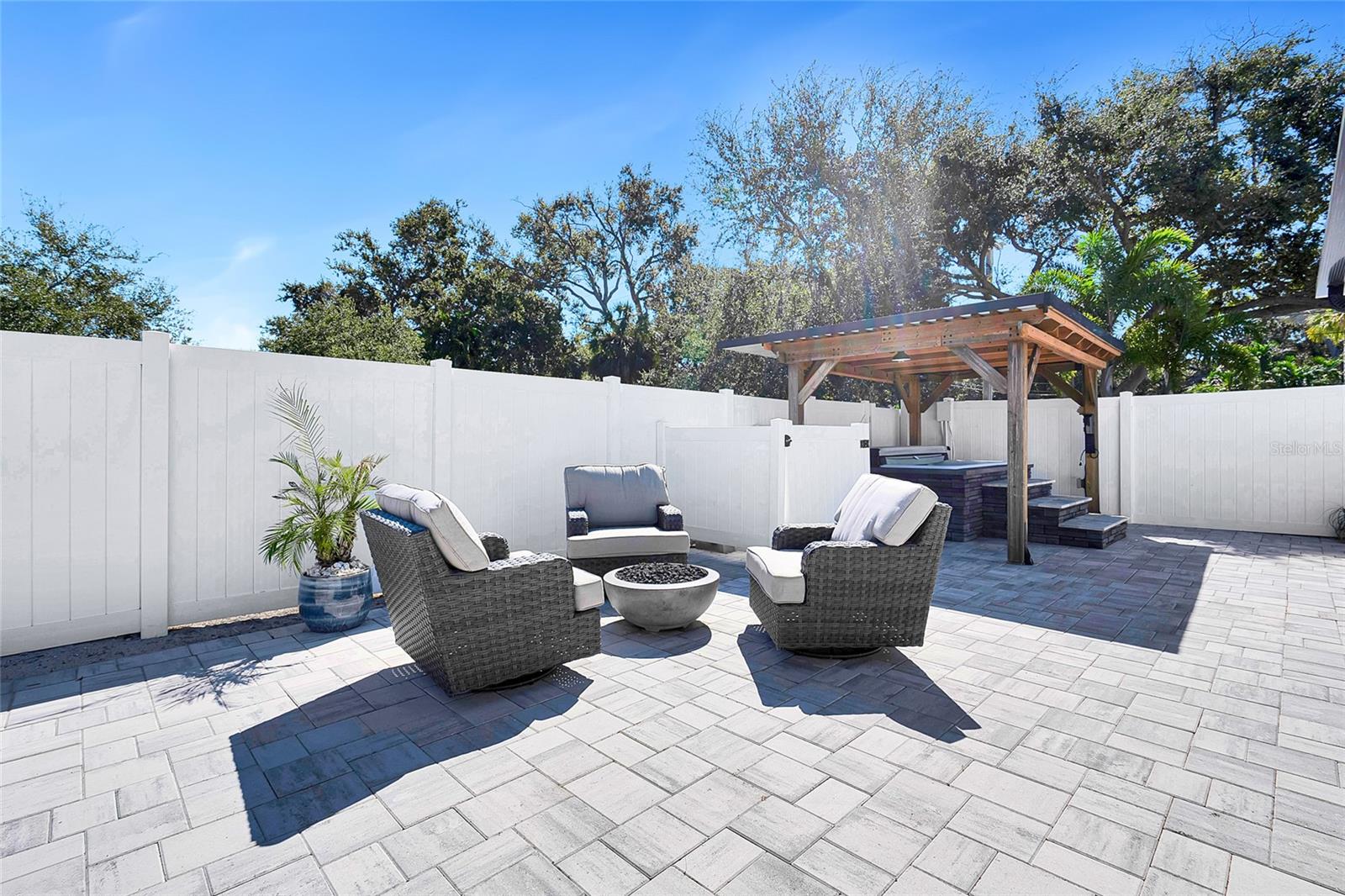 Fire pit and hot tub under pergola