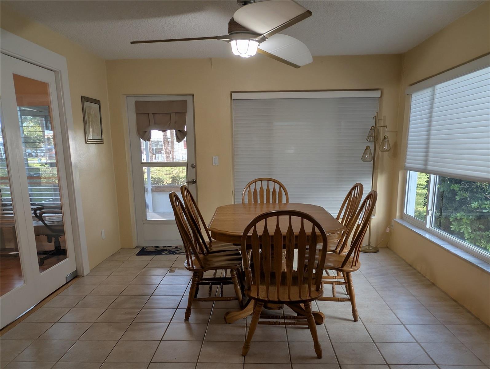 Sunroom offers great natural light. It is a very versatile space offering flexibility for its use...dining, den, mancave, crafts, office.
