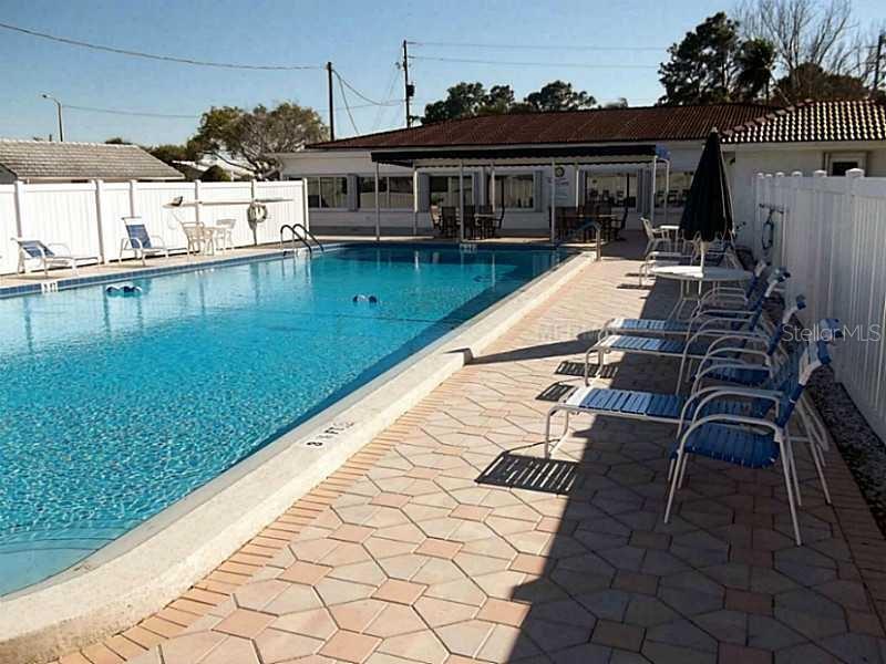 Beautiful pool area is wonderful spot to relax and enjoy the sunshine or a cool dip.