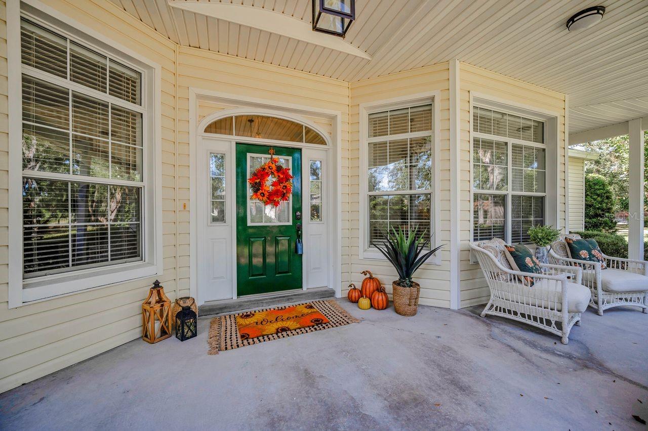 What an amazing and spacious front porch to welcome guests!