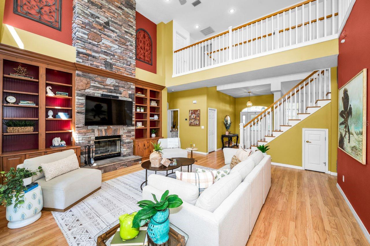 A gorgeous staircase with finished storage underneath, custom built-in bookshelves, an amazing walkway above that leads to the loft, 2 bedrooms with a Jack & Jill bathroom, and more storage than you will know what to do with!