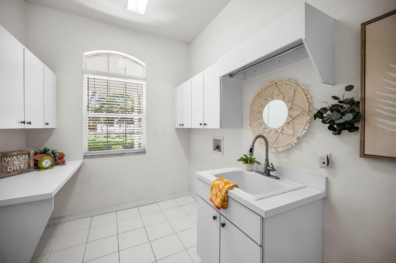 A generously sized laundry room with lots of storage!