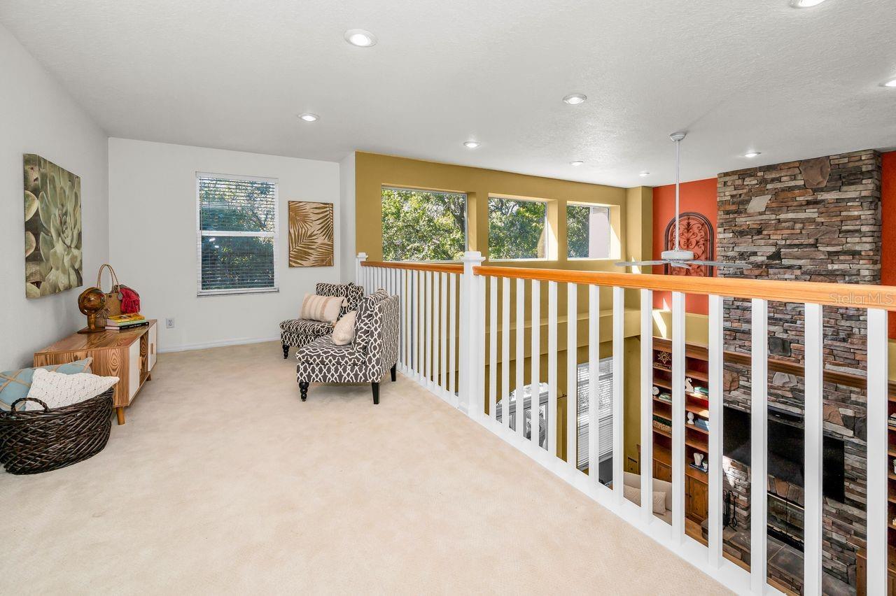 A spacious loft looking down into the living area