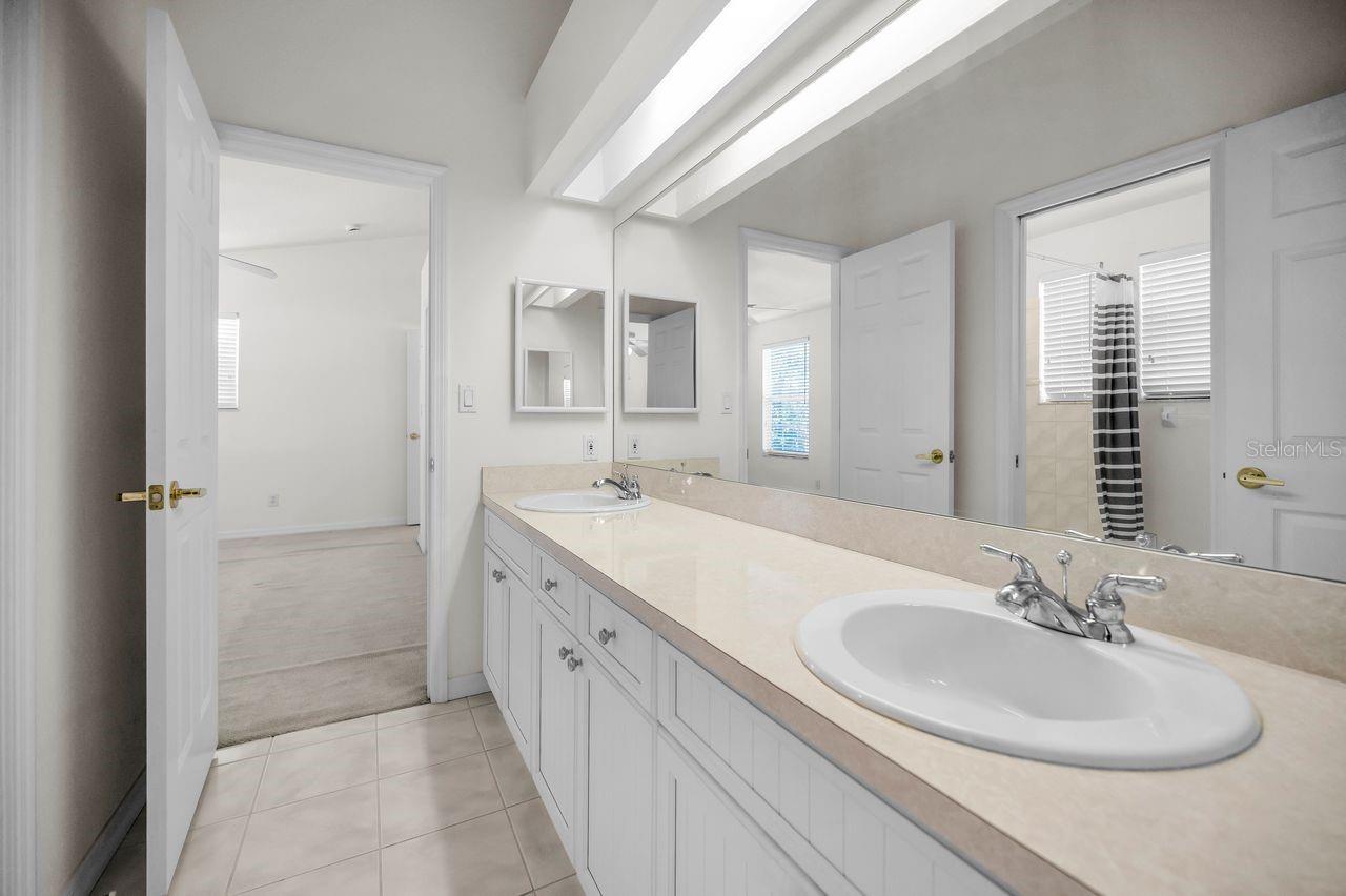 Dual sinks in this Jack and Jill bathroom.