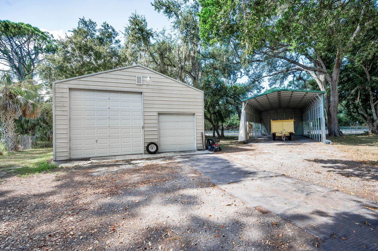 This 40' x 60' garage is insulated, has power, 3 electric roll up doors, and will fit an RV plus all the other toys.