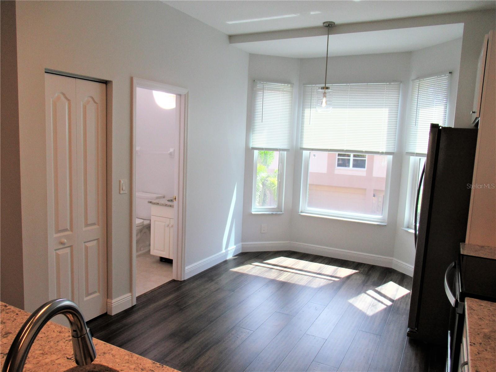 Kitchen - Half Bath and pantry on the left