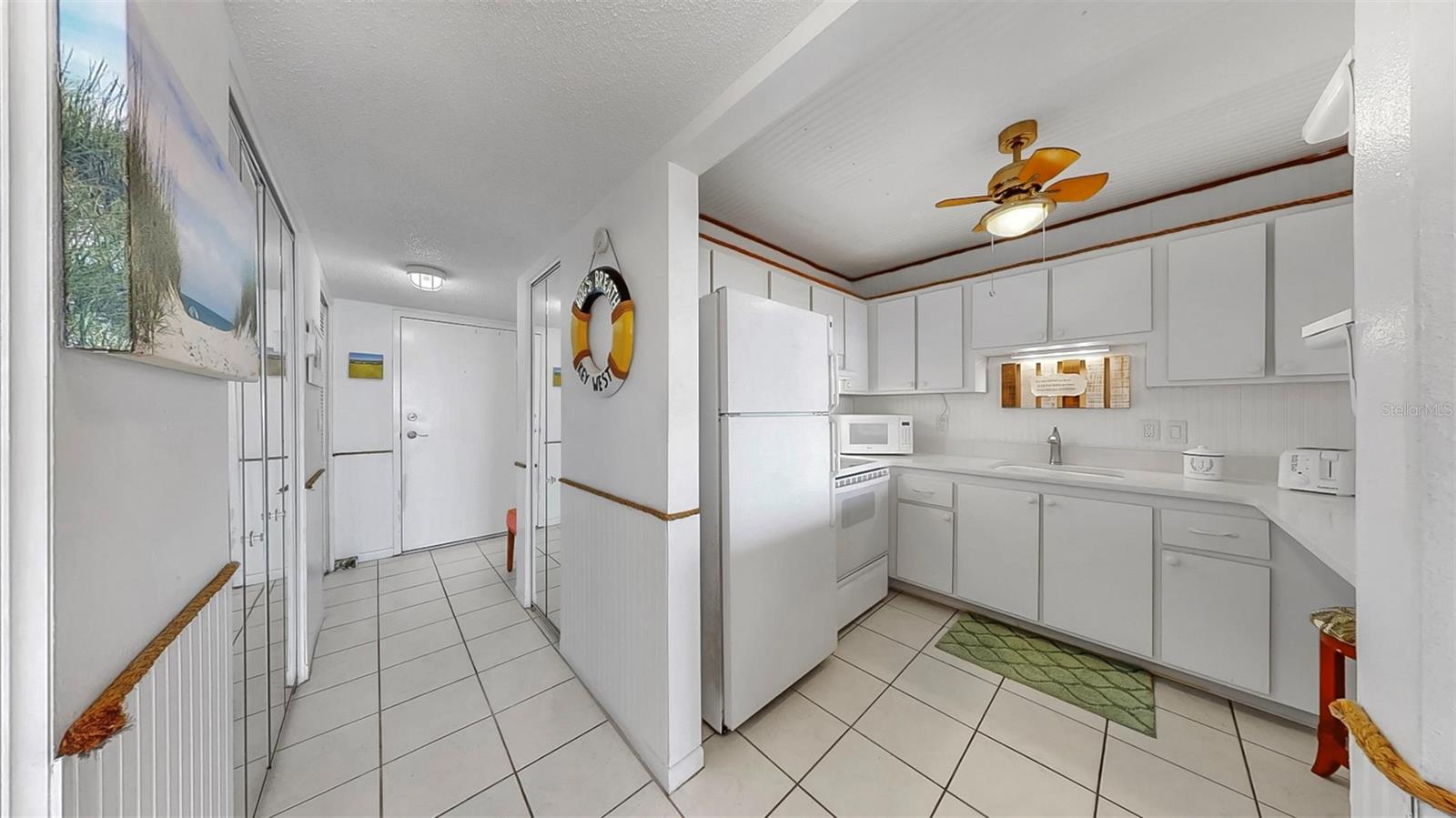 Kitchen and entrance with closets for extra storage.