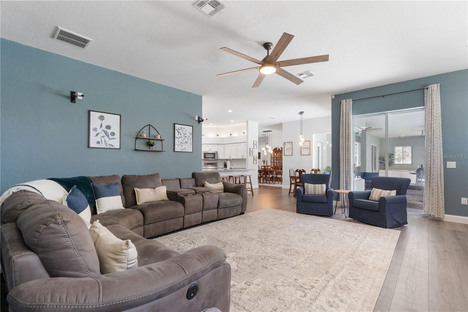 In the living room you can stay connected with people in the kitchen, breakfast nook, and formal dining area.