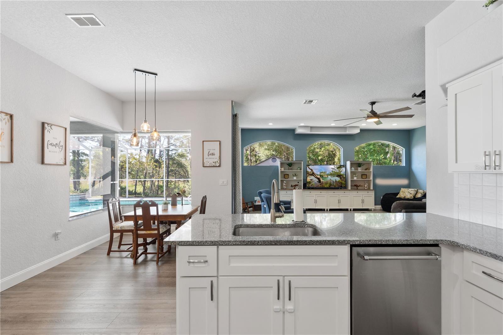 Such a bright inviting home. Kitchen has stone counter tops.