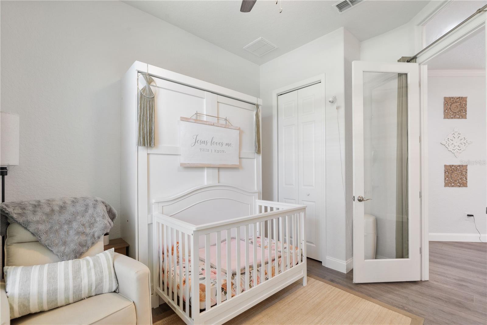 There is a closet in this bonus room, and a set of glass doors. This would be an ideal room for a home office.
