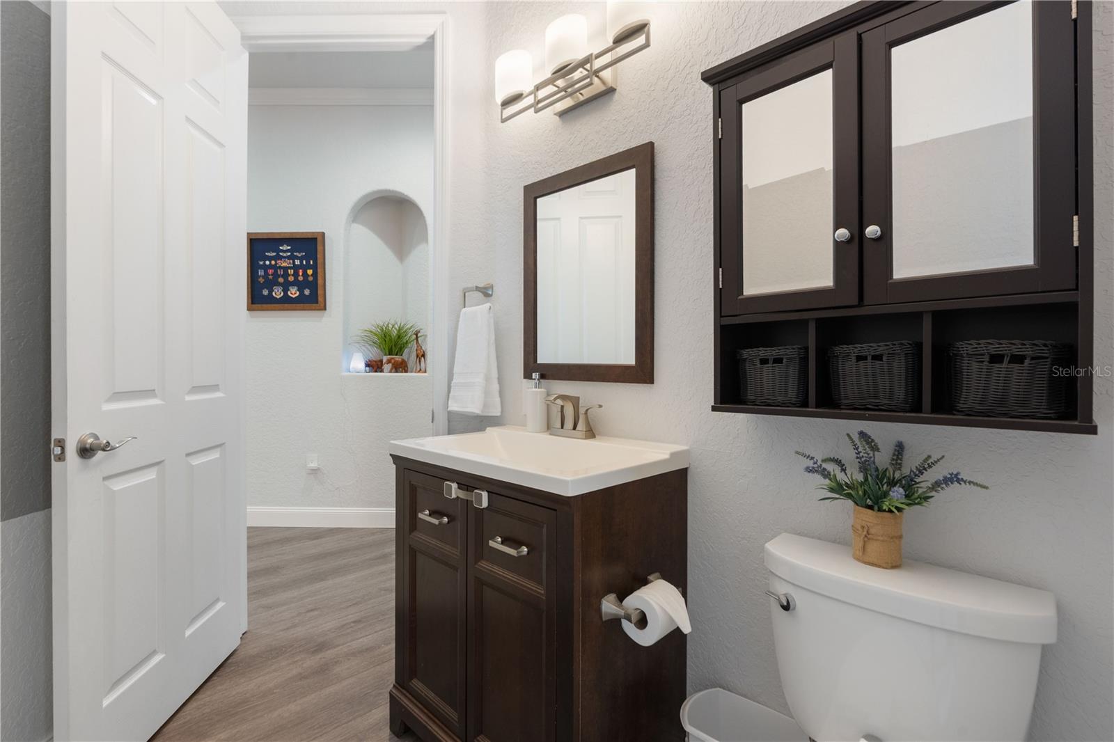 This is the half bath that leads out to the pool. Close to the bonus room and formal living area.