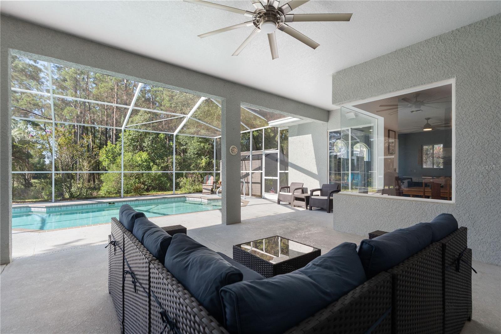 A pool home with a view. Partially wooded with pines on the property.