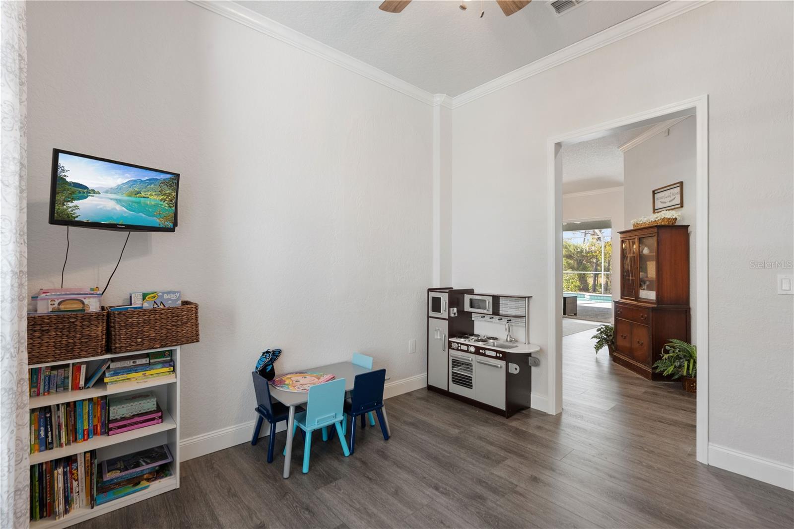 This flex room faces North and is across from the kitchen. Ideal space for playroom, home gym, office or craft room.