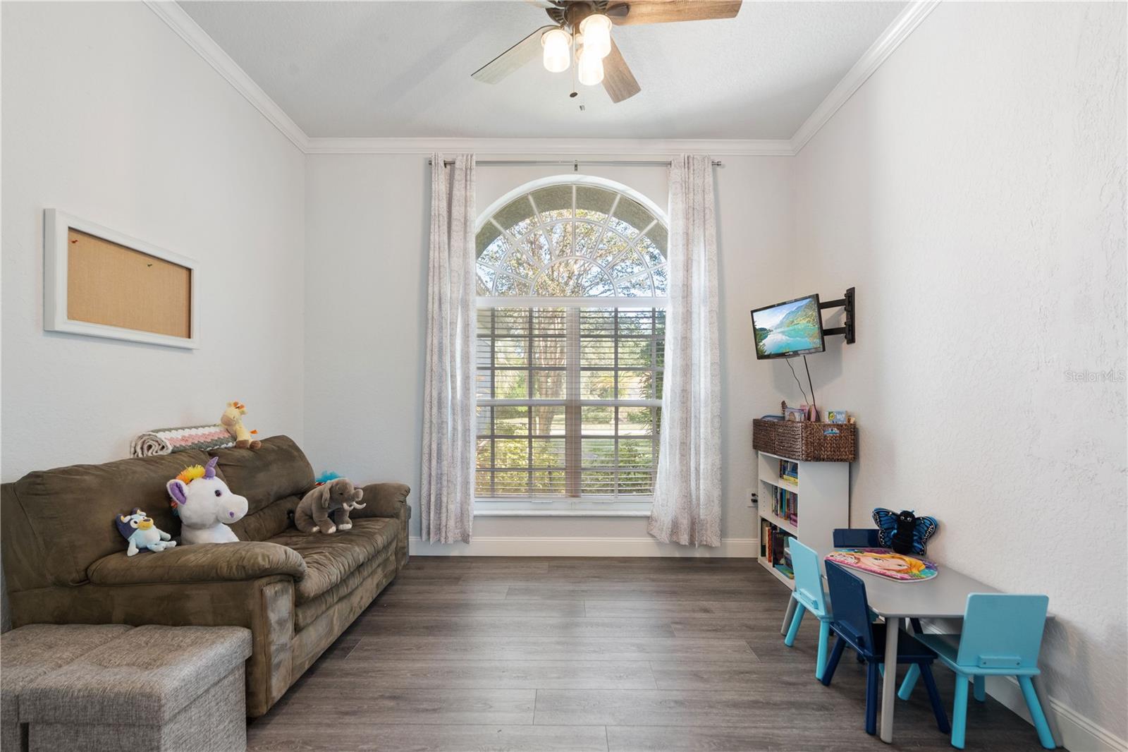 This room faces North and house crown molding. This room could also be suitable for a formal dining area for holidays and special events and it is across from the kitchen,