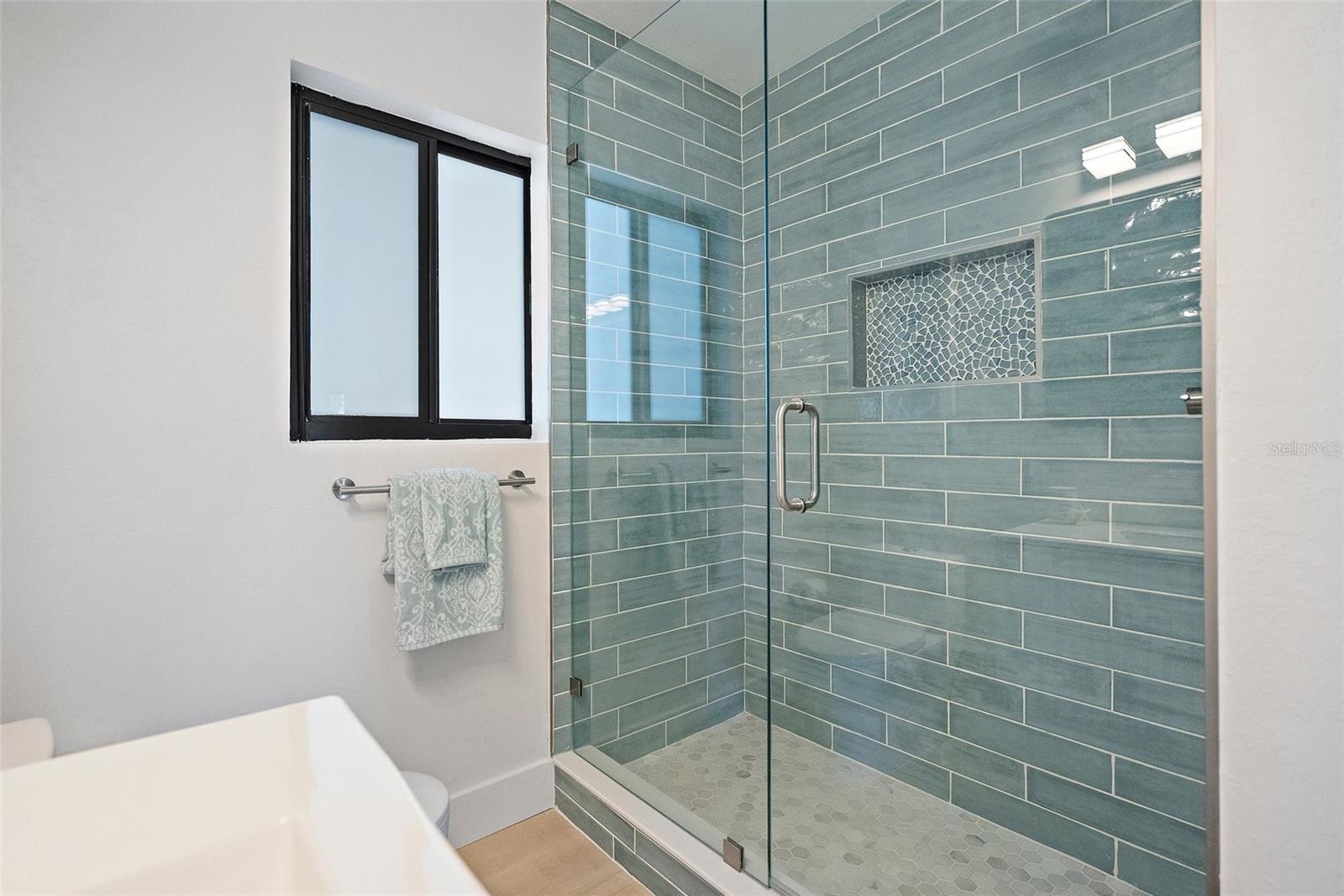 Beautiful Tile and accents. Glass Door - swings in/out