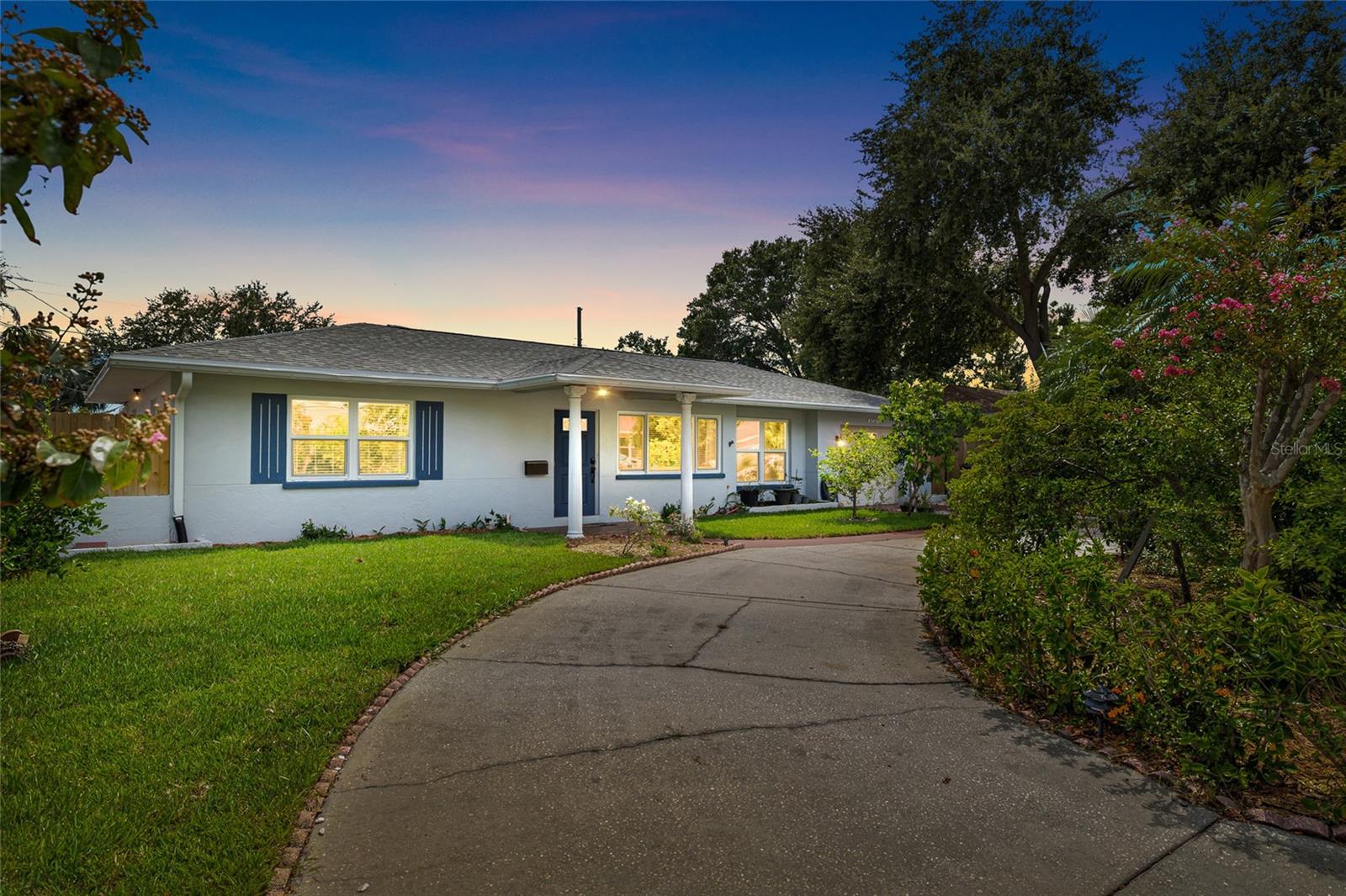 Front of home with circular driveway