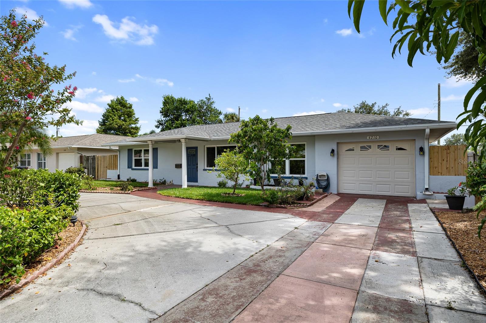 Front of house and driveway to garage