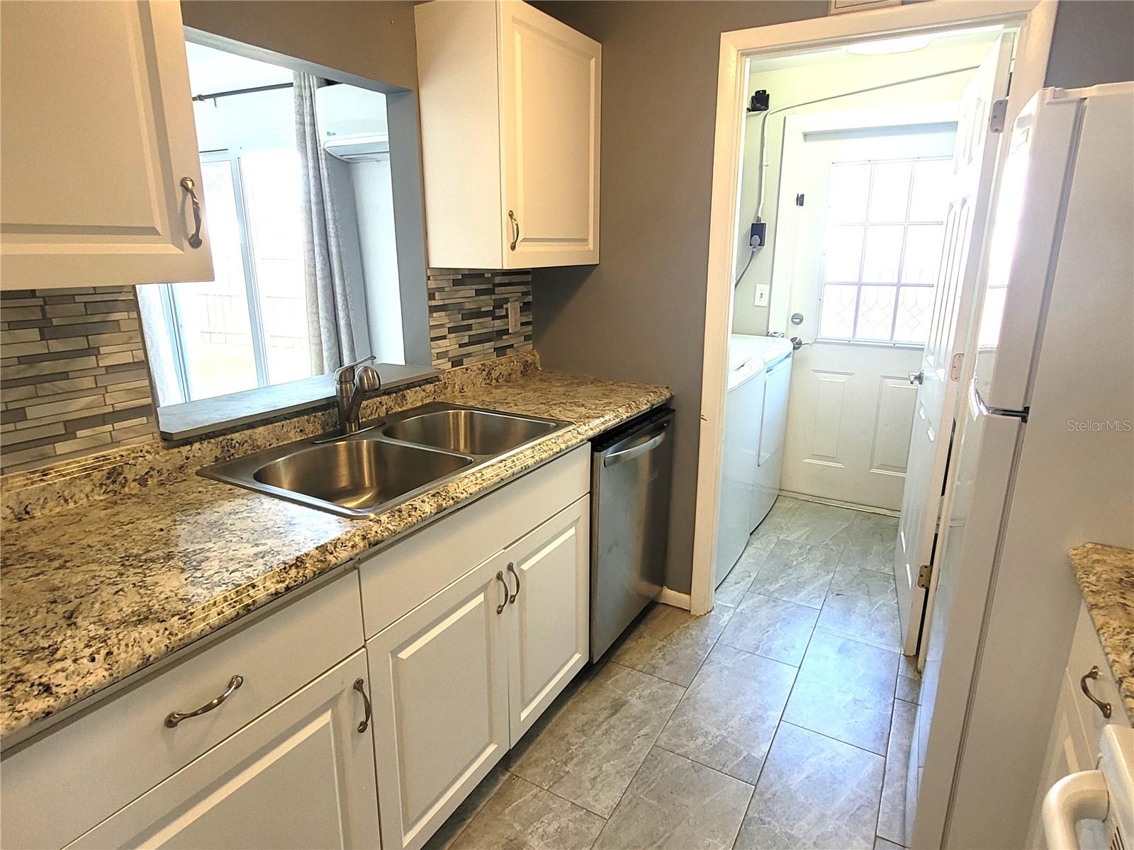 Kitchen with adjacent Laundry Room
