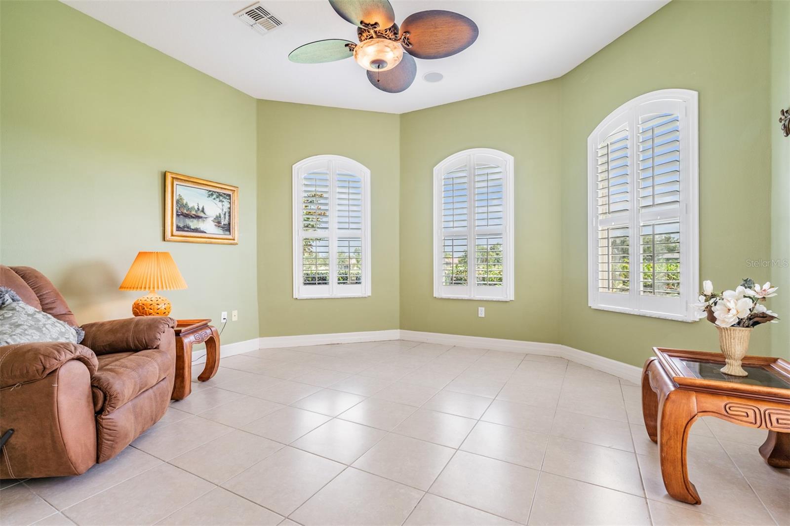 BONUS room at rear with triple windows, plantation shutters and great views!