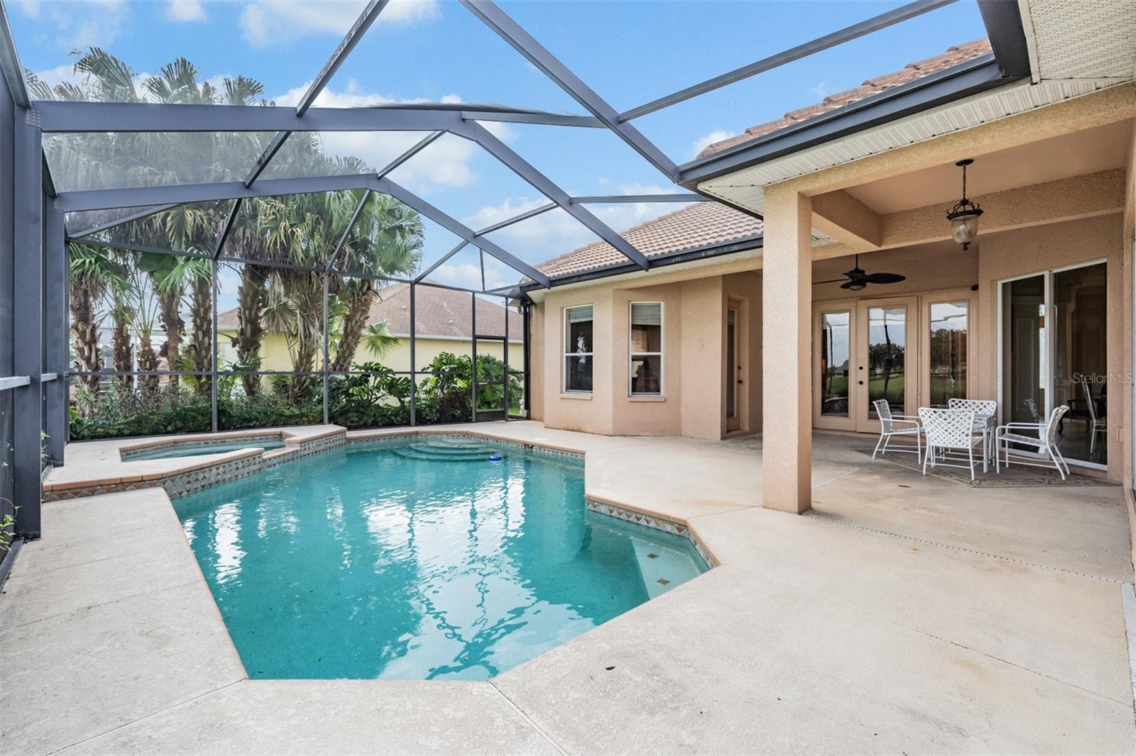 Side patio off bonus room view of pool