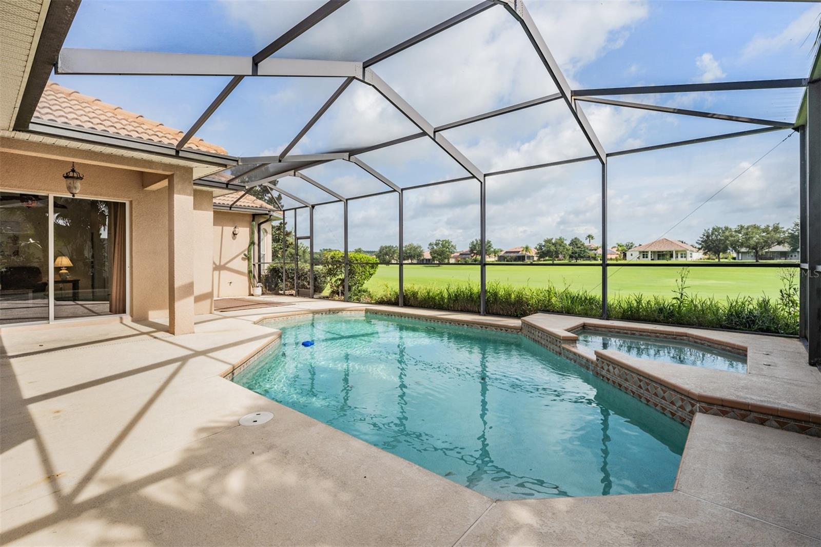 Screened pool area with 2 seating areas