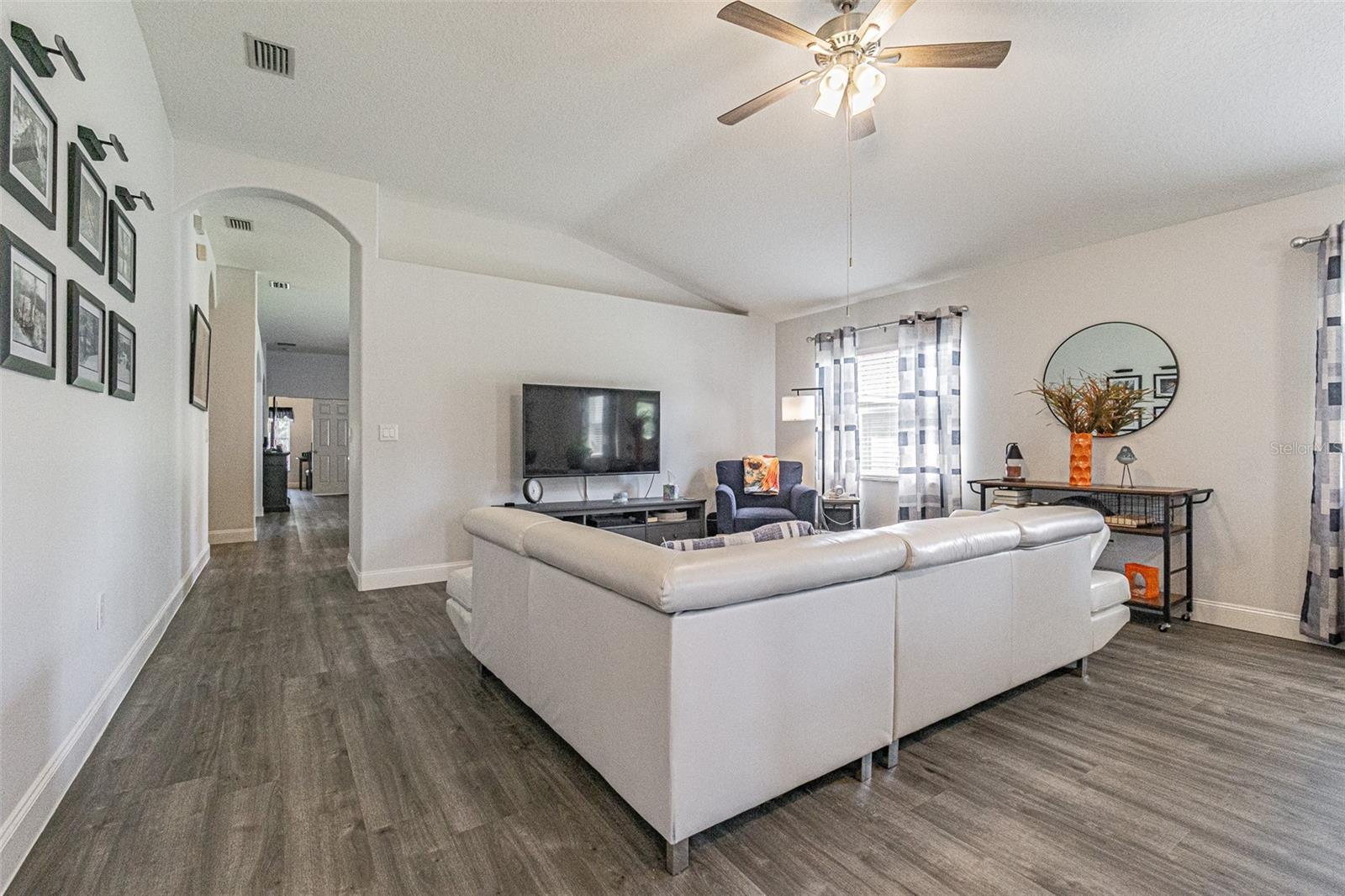 vaulted ceilings & plant shelves add architectural interest