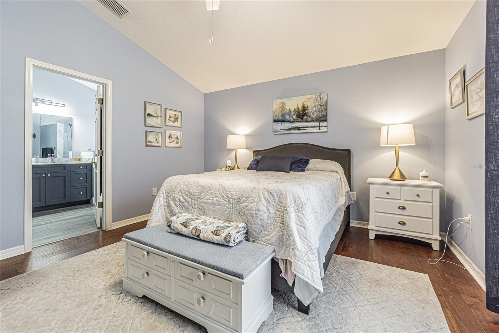 Primary bedroom with wood floors