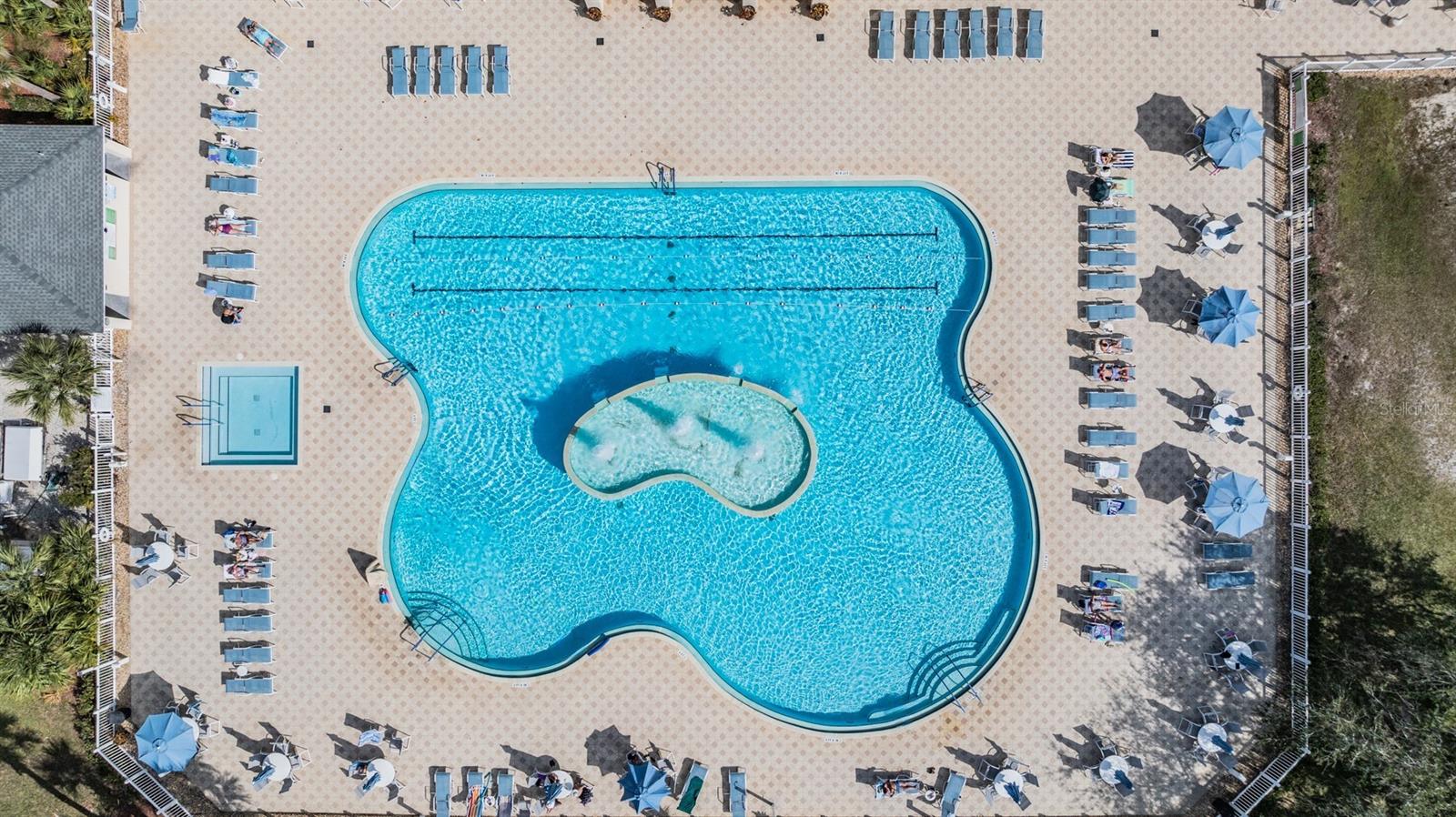 Resort style pool with fountains and lap lane