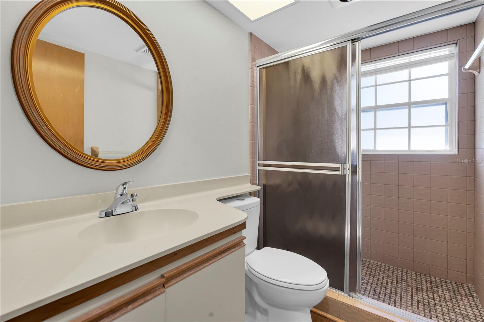 2ND BATHROOM IS ACROSS THE HALL FROM THE 2ND BEDROOM; SERVES AS THE MAIN GUEST BATHROOM AS WELL; SHOWER BIG ENOUGH FOR TWO :); NEW FAUCET AND COMMODE; NEW LAMINATE FLOOR  (1377 MCMULLEN BOOTH RD)