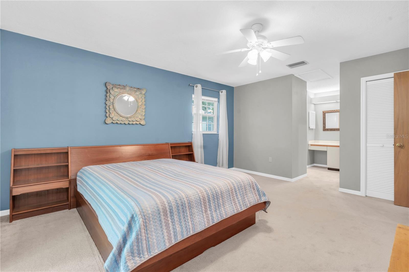 PRIMARY BEDROOM, ENSUITE BATHROOM, BRING YOUR SASSY MAKEUP THRONE AND BLOW-UP MIRROR FOR A DAILY GLOW-UP; SINGLE SINK IN VANITY WITH STORAGE AND DRAWER; ON THE RIGHT IS A GENEROUS WALL CLOSET; AND WAIT 'TIL YOU SEE ALL THE CLOSETS IN THE EN SUITE AREA!  (1377 MCMULLEN BOOTH RD)