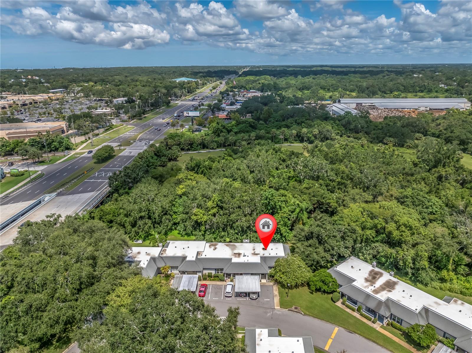 OH WOW! THAT DRONE HAS SOME ALTITUDE! THAT'S MCMULLEN BOOTH RD TO THE LEFT, BUT YOU CAN'T HEAR IT FROM INSIDE THIS PLACE! DOWNTOWN CLEARWATER IS TO THE WEST; DT TAMPA IS TO THE EAST; DT ST PETE IS TO THE SOUTH, ALL ABOUT A 20 MINUTE DRIVE, UNLESS SOME OTHER DRIVER HAS CAUSED AN UNFORTUNATE MISHAP  (1377 MCMULLEN BOOTH RD)