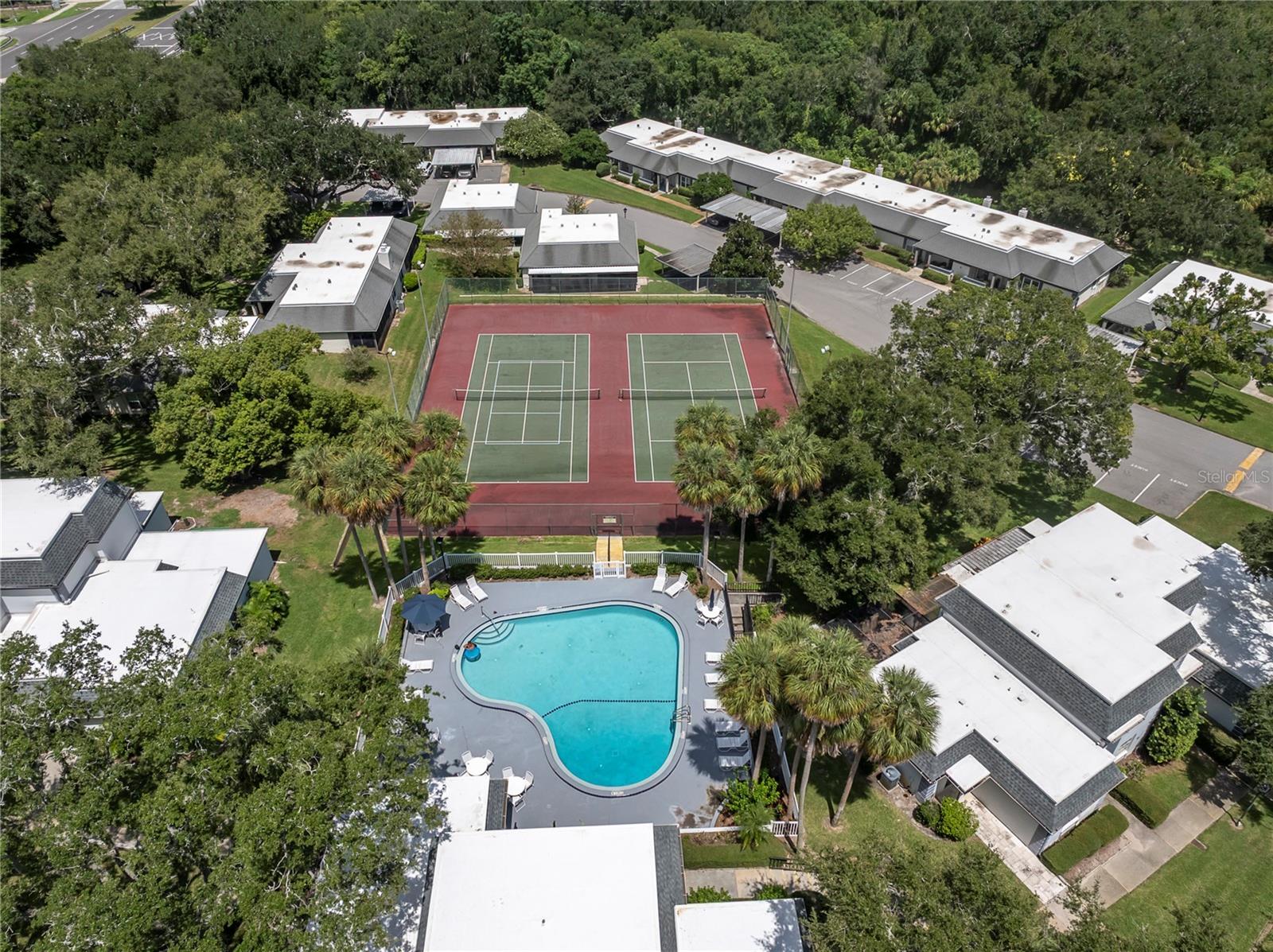 OOOO, WE HAVE ZOOMED DOWN TO GET A CLOSE-UP OF ALL THE FUN STUFF: TENNIS, PICKELBALL, POOL, AND UNDER THOSE CRISP WHITE ROOFS ARE THE CLUBHOUSE, BILLIARDS, FITNESS, COMMUNITY KITCHEN, DINING AND LOUNGE SPACES  (1377 MCMULLEN BOOTH RD)