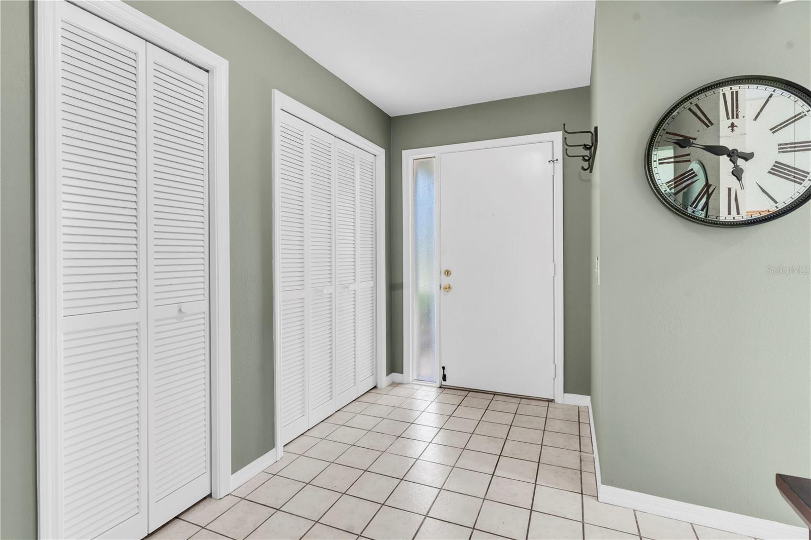 INSIDE, FRONT ENTRY; DOUBLE DOOR CLOSET IS COATS AND STORAGE; SINGLE DOOR HOUSES AIR HANDLER; KITCHEN IS TO THE RIGHT (1377 MCMULLEN BOOTH RD)