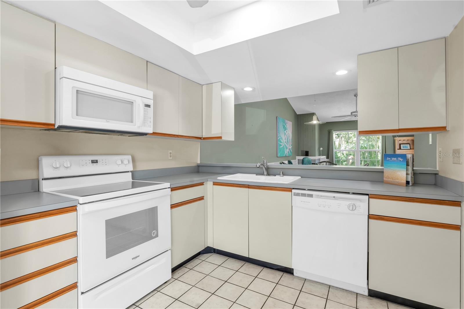 ANOTHER ANGLE OF THE KITCHEN AND VIEW OUT OVER THE BREAKFAST BAR TO DINING/LIVING  (1377 MCMULLEN BOOTH RD)