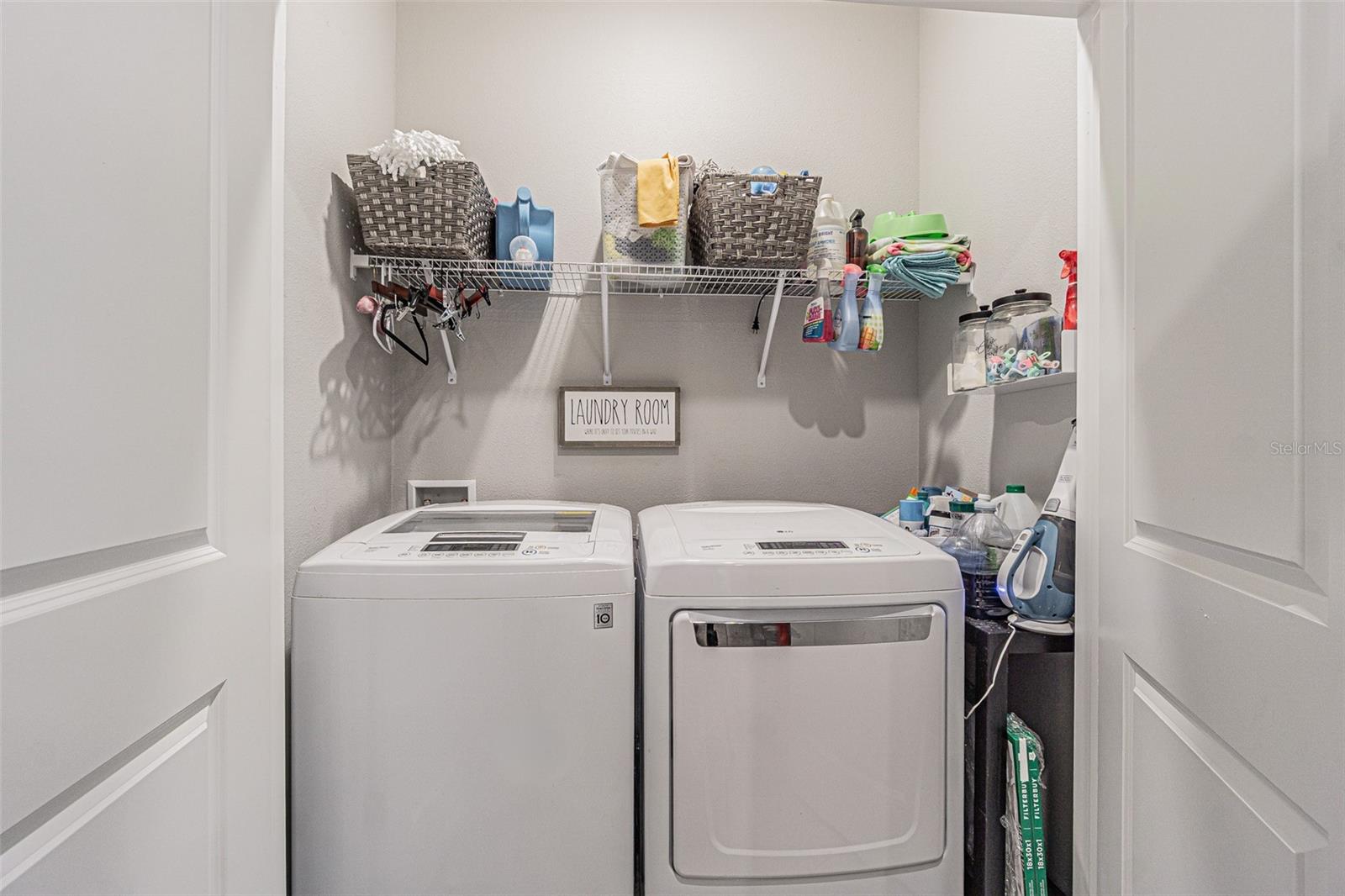 Interior laundry closet on wing with secondary bedroom