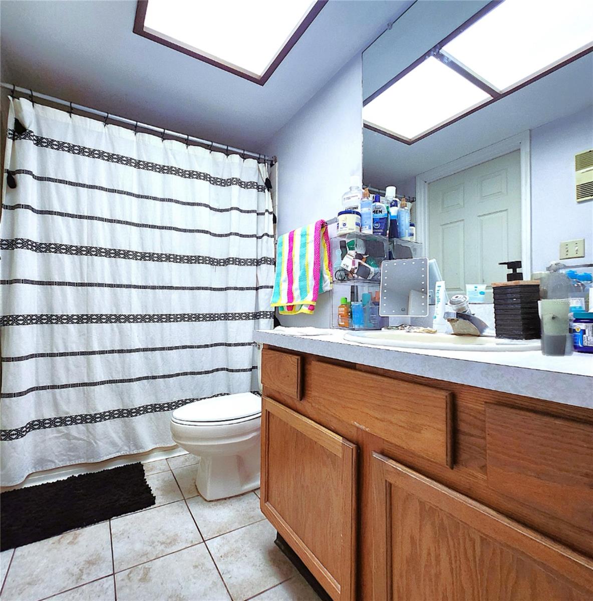 Bathtub, Shower, lLnen Closet, Medicine Cabinet. Bathroom has two access doors