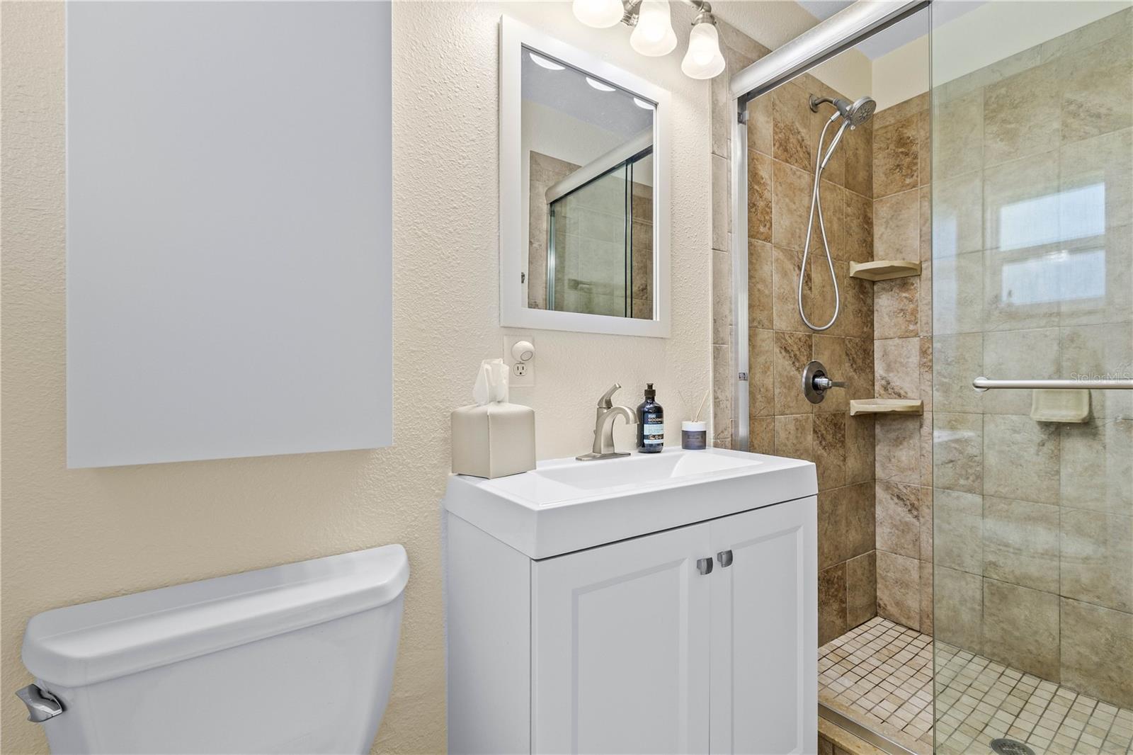 Primary bath with glass enclosure