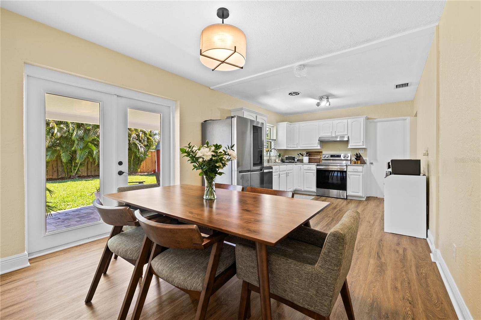 Dining with French Doors to back yard patio