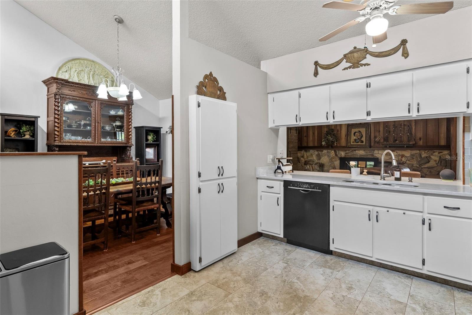 Updated kitchen featuring quartz countertops, snack bar seating, and newer stainless steel appliances (2019).