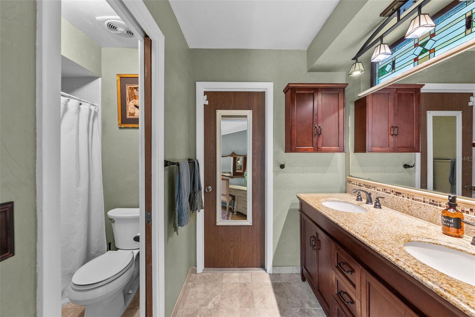 Updated ensuite bath with modern finishes for comfort and convenience.